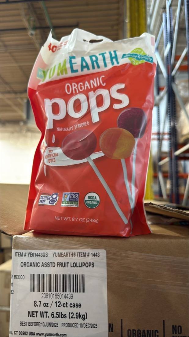 Case label showing the best-before date on organic lollipops, checked by candy buyers