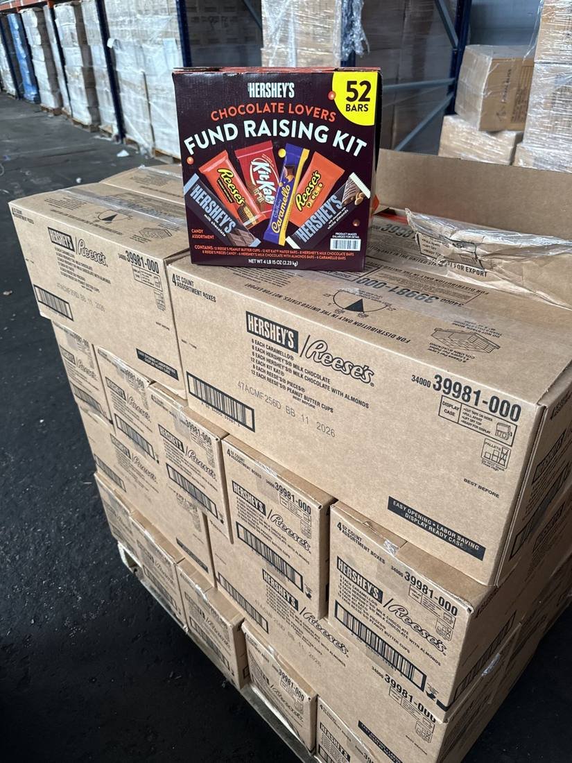 Hershey's and Reese's fund raising kit cases on a pallet of short-dated candy with the best-by date printed on the carton