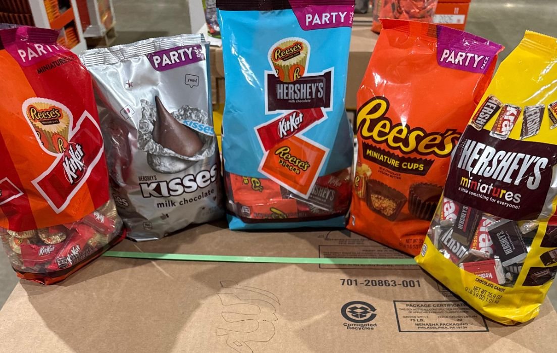 Hershey's and Reese's party-size candy bags on a sealed case, the kind of bagged candy we buy