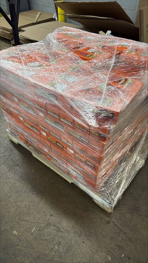Shrink-wrapped pallet of Reese's candy ready for pickup by candy buyers
