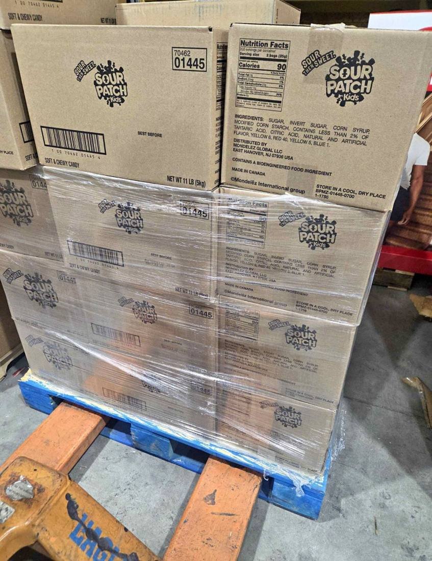 Wrapped pallet of Sour Patch Kids cases waiting for candy liquidation pickup
